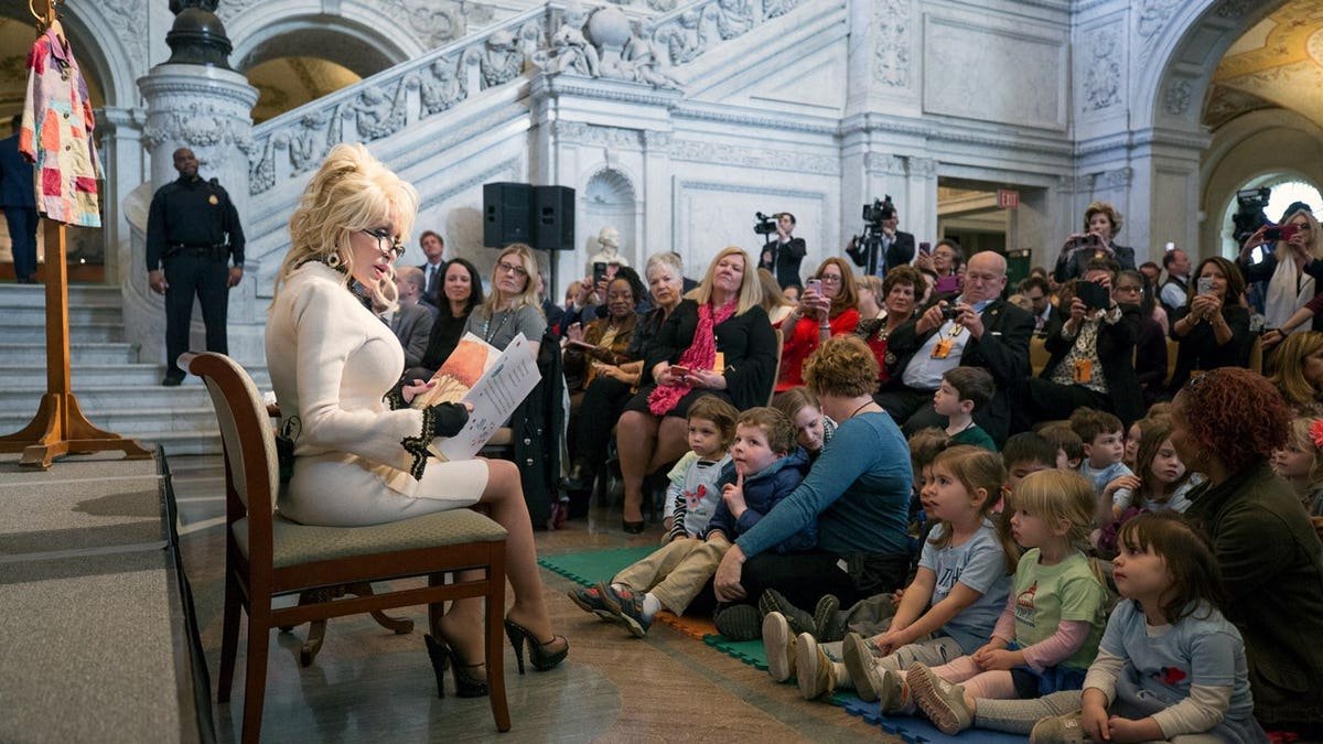 Dolly Parton reads to children at the Library of Congress