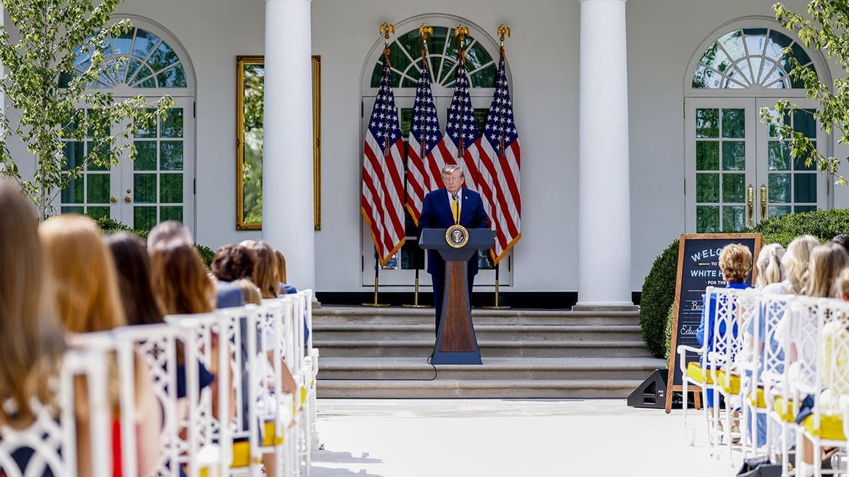 Donald Trump stands during an event in the White House Rose Garden.