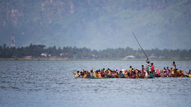 Crowded boats crossed the river.