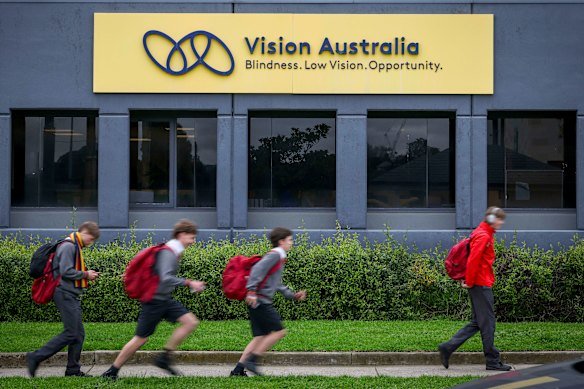 Scotch College students head home past the Vision Australia head office. 
