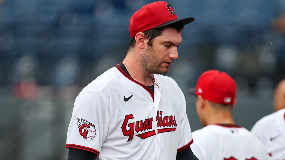 Gavin Williams walks to the dugout during a rain delay at Progressive Field.