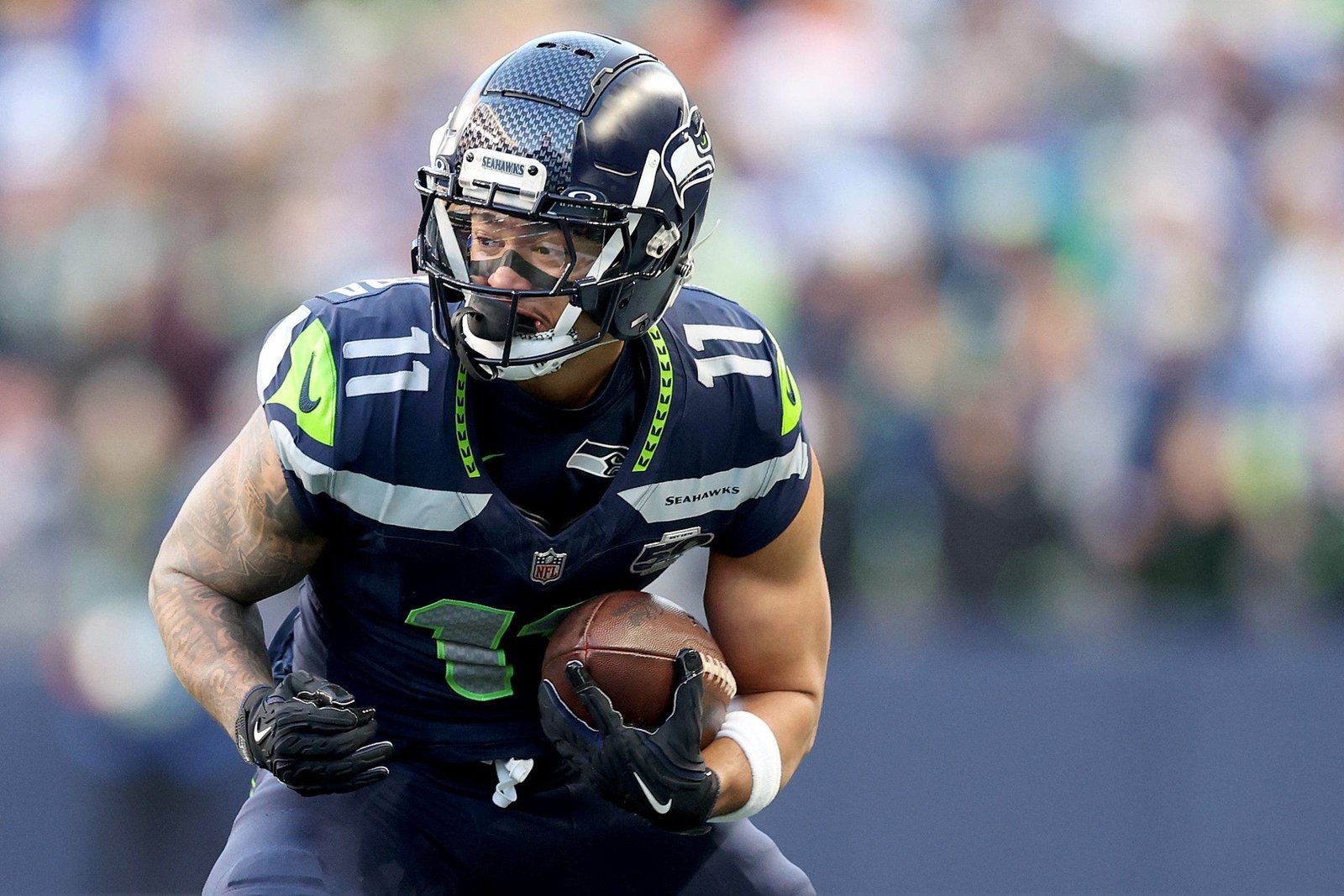 Jaxon Smith-Njigba led the NFL in receptions and receiving yards in 2025, winning Offensive Player of the Year. (Photo by Steph Chambers/Getty Images)