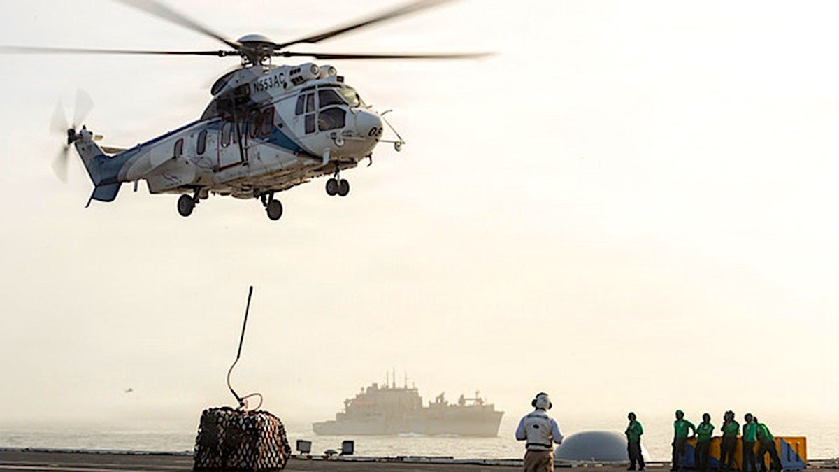 Helicopter above USS George Washington