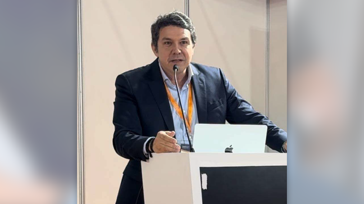 Joao Araujo standing at a podium