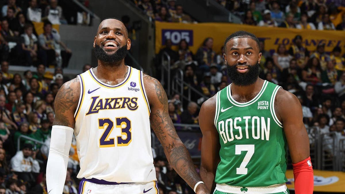 LeBron James and Jaylen Brown look on during an NBA game.