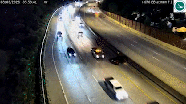 Vehicle narrowly avoids slamming into driver on side of Ohio highway, dramatic video shows Vehicle narrowly avoids slamming into driver on side of Ohio highway, dramatic video shows