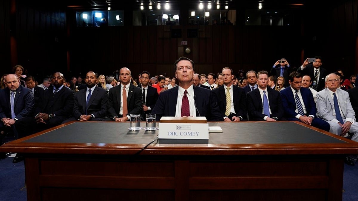 Former FBI Director James Comey testifies before a Senate Intelligence Committee hearing on Russia's alleged interference in the 2016 U.S. presidential election on Capitol Hill in Washington, U.S., June 8, 2017. REUTERS/Jonathan Ernst - HP1ED681F68T4
