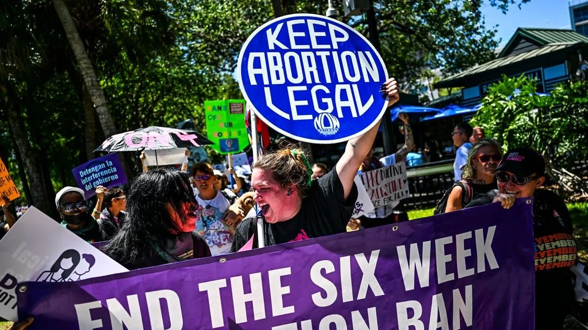 Protestors holding signs