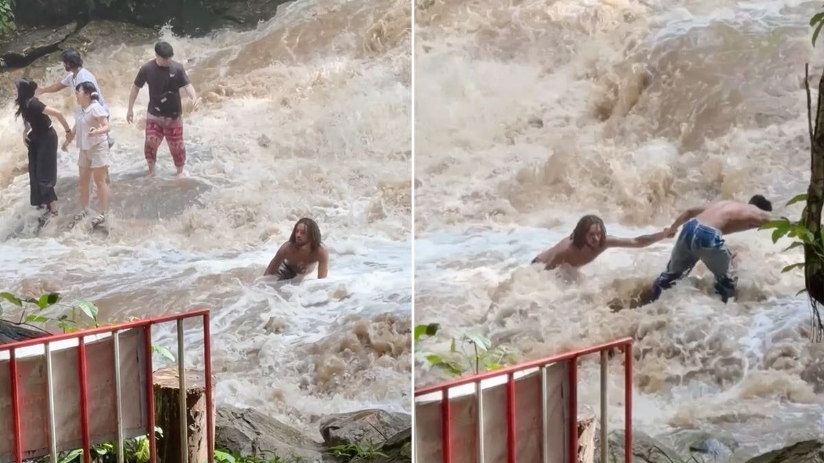 Tourists stranded in a waterfall in Thailand.