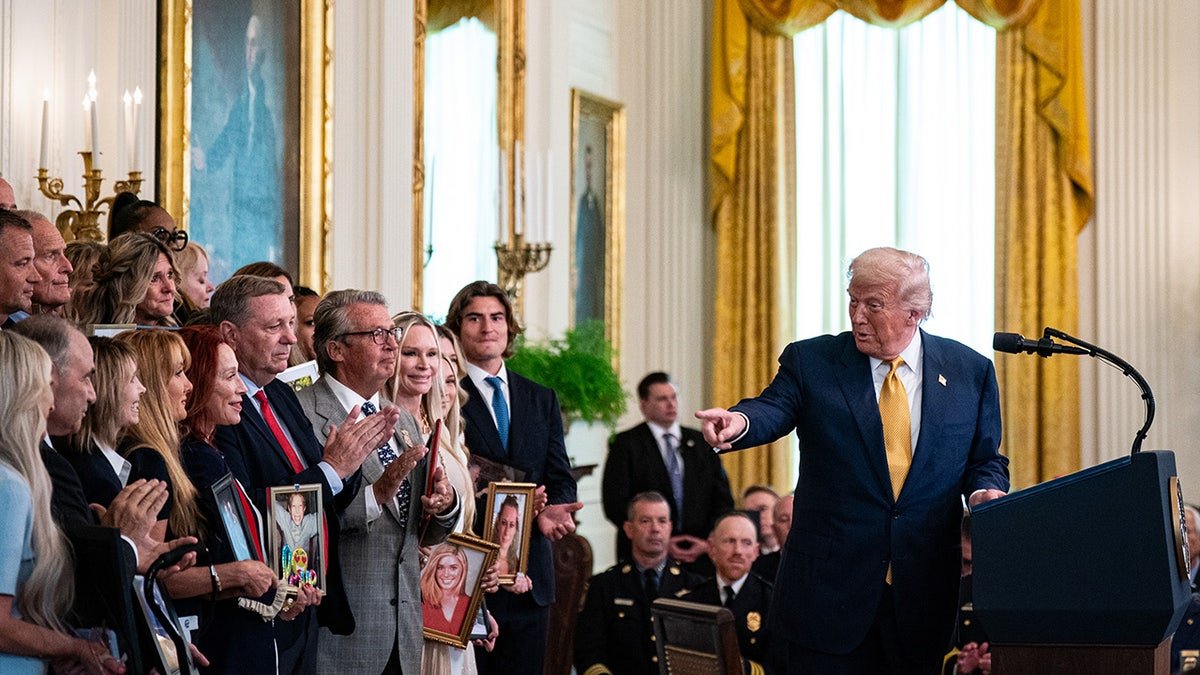 Trump talks to families of fentanyl victims during a bill signing ceremony