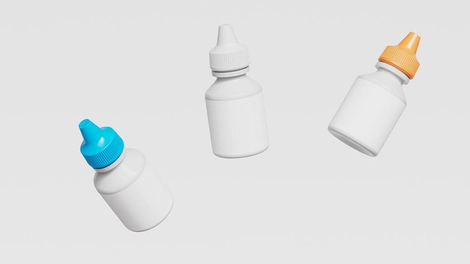 three unlabled eyedrop bottles