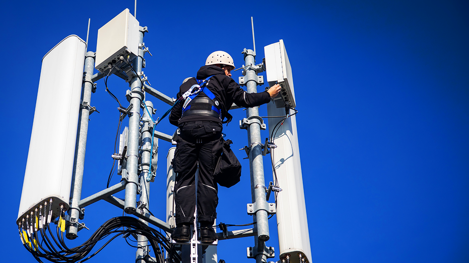 U.S. tower climber working on a cell tower