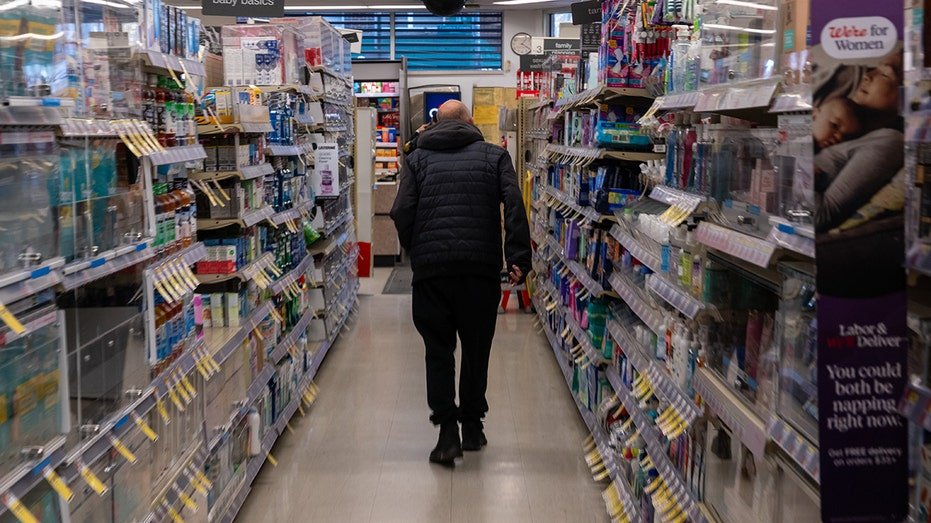 People shop at a Walgreens