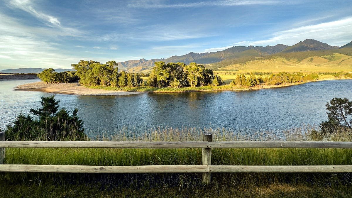 Yellowstone River flows through Paradise Valley with Absaroka Mountains in the background.