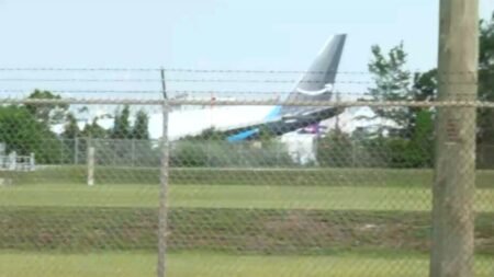 Amazon cargo plane overruns Miami airport runway, striking ‘multiple’ vehicles and catching fire