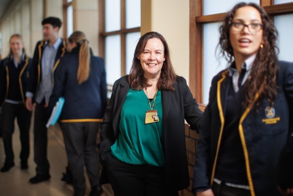 Principal of Sandringham College Amy Porter with some of her students. 