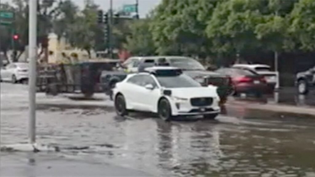 Video shows Waymo driverless vehicle stuck in ‘AI loop’ on flooded Phoenix street