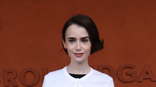 Lily Collins in on-trend white jazz shoes.
