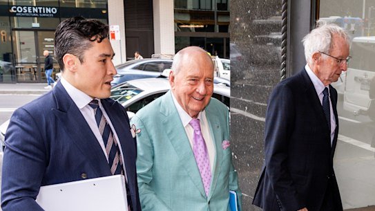 Alan Jones (centre) and lawyers arrive at Downing Centre Local Court on Tuesday.