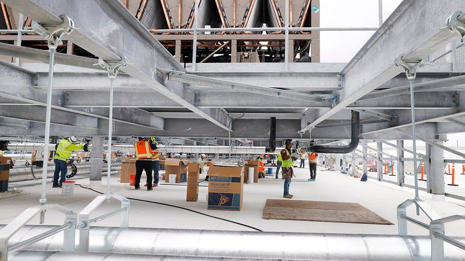 Workers at a data center construction site