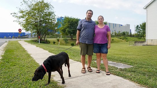 Lindsay Shaw and partner Bob Salehi outside the Ashburn II Data Centre Campus, which is just metres from their home.