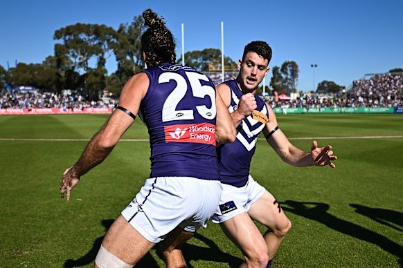 Alex Pearce and Patrick Voss warm up ahead of the clash with North Melbourne at Hands Oval in Bunbury in round 13.