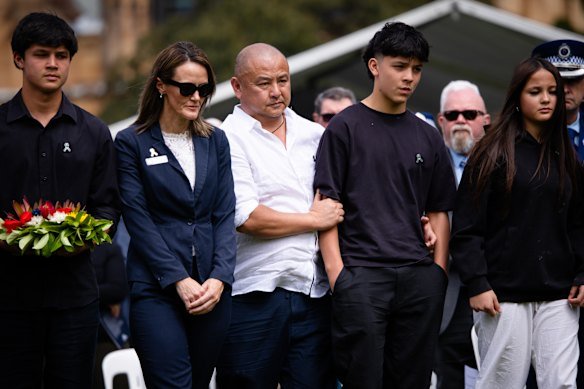 The family of Constable Mia Lay attends the Wall of Remembrance event at the Domain in Sydney.