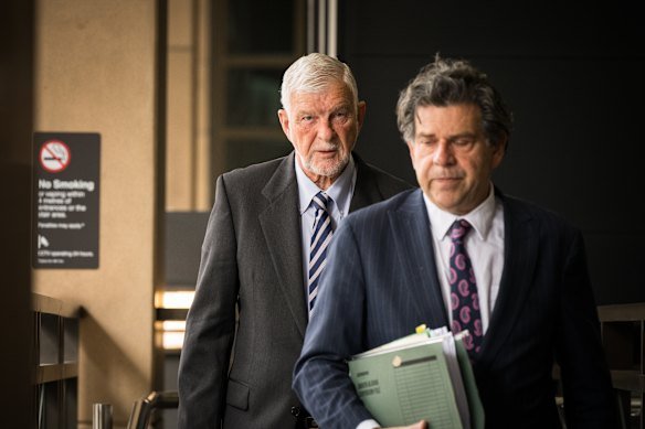 Alan Boulton (left) leaves the Melbourne Magistrates’ Court.