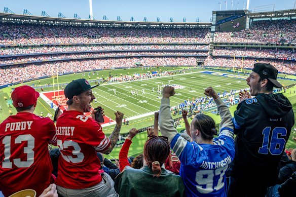 Fans show their support at the NFL game at the MCG.