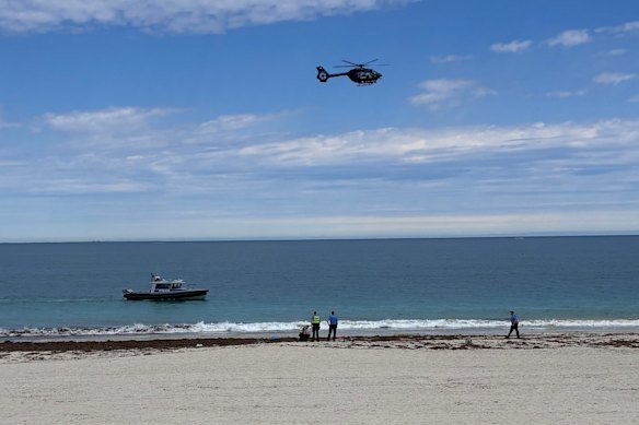The scene at Sorrento Beach, in Perth’s north, on Friday morning after a suspected shark attack.