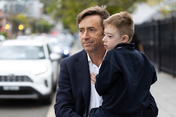Mark Johnston picks up his son Owen from Wollongong Public School. 