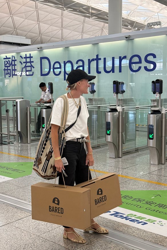 Anna Baird on her way back to Australia from China with Minogue’s boots.