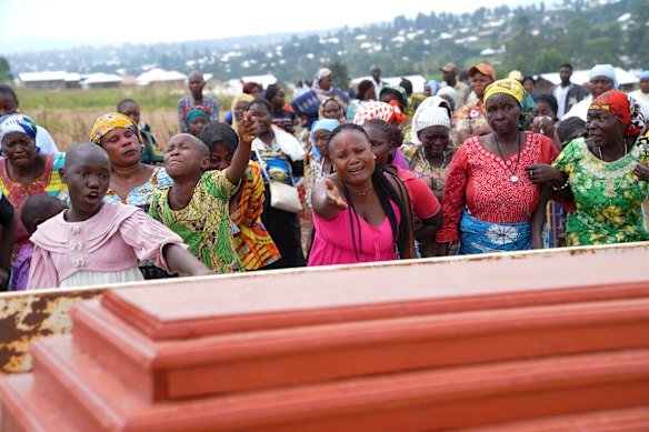 Relatives cry during the burial ceremony of Abineno Justine, a 38-year-old woman who died of the Ebola virus, in Bunia, Congo, earlier this month.