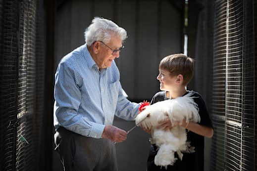 Chookas for next year’s show: Alf Woods, 98, and his great-grandson, Blair, 10, at the family chicken coops in Greenvale.