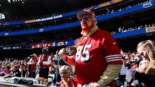A 49ers fan watches the action at the MCG.