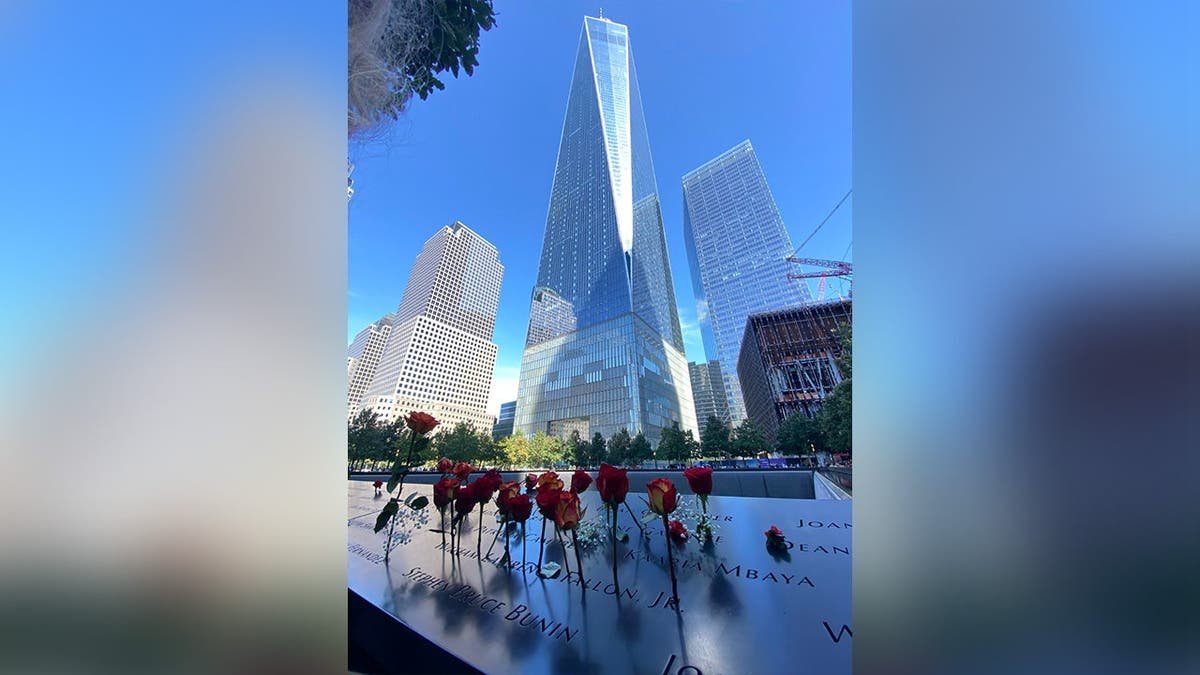 image shows roses laid near victim's name