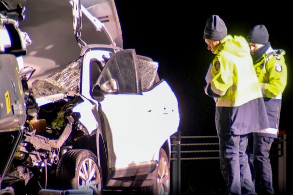 Two people in a white ute died at the scene. 