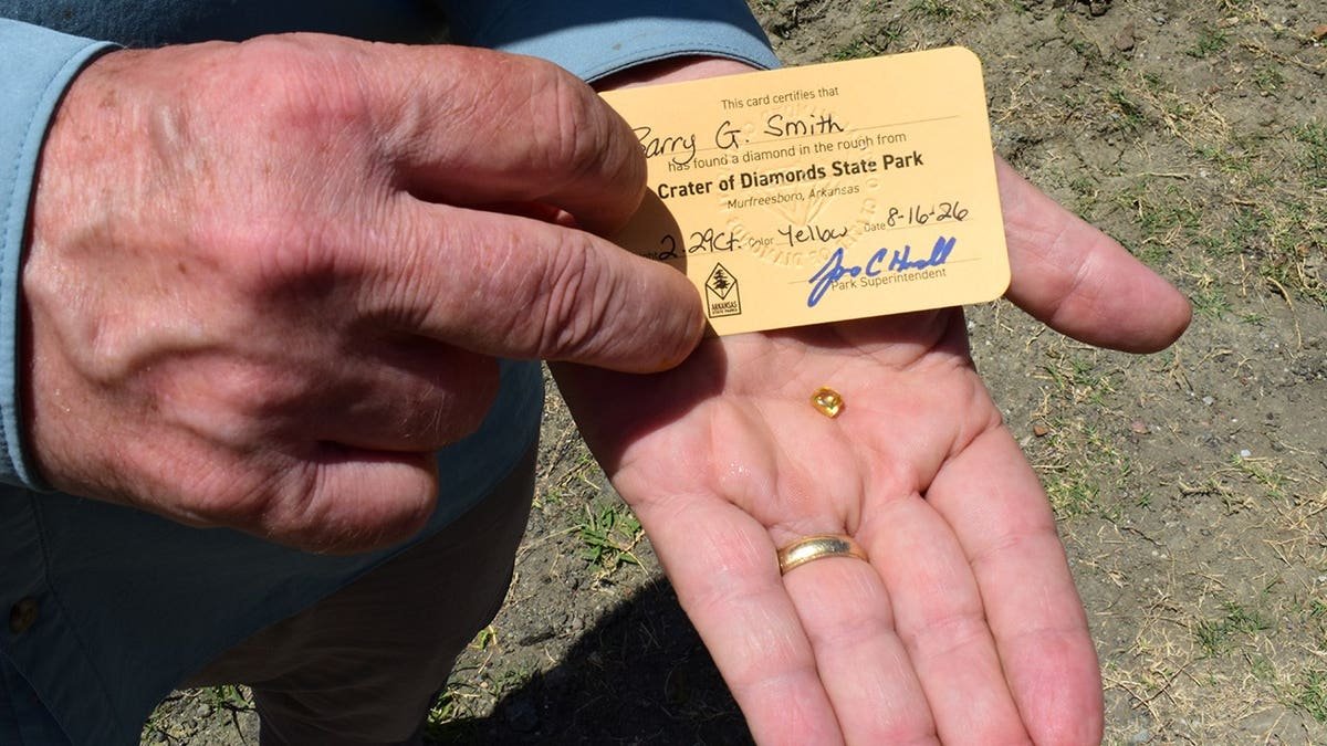 Close-up view of Smith's hand holding diamond