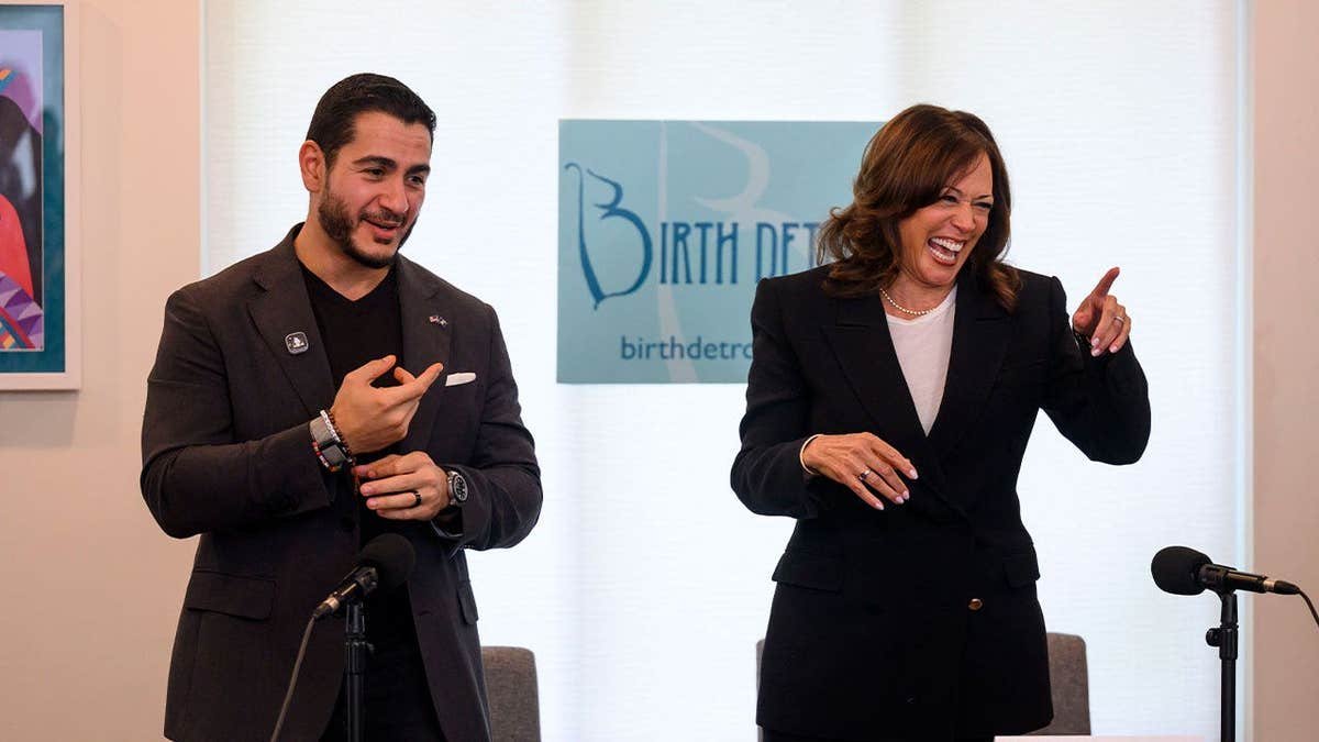 Kamala Harris and Michigan Senate candidate Abdul El-Sayed sit at a roundtable in Detroit