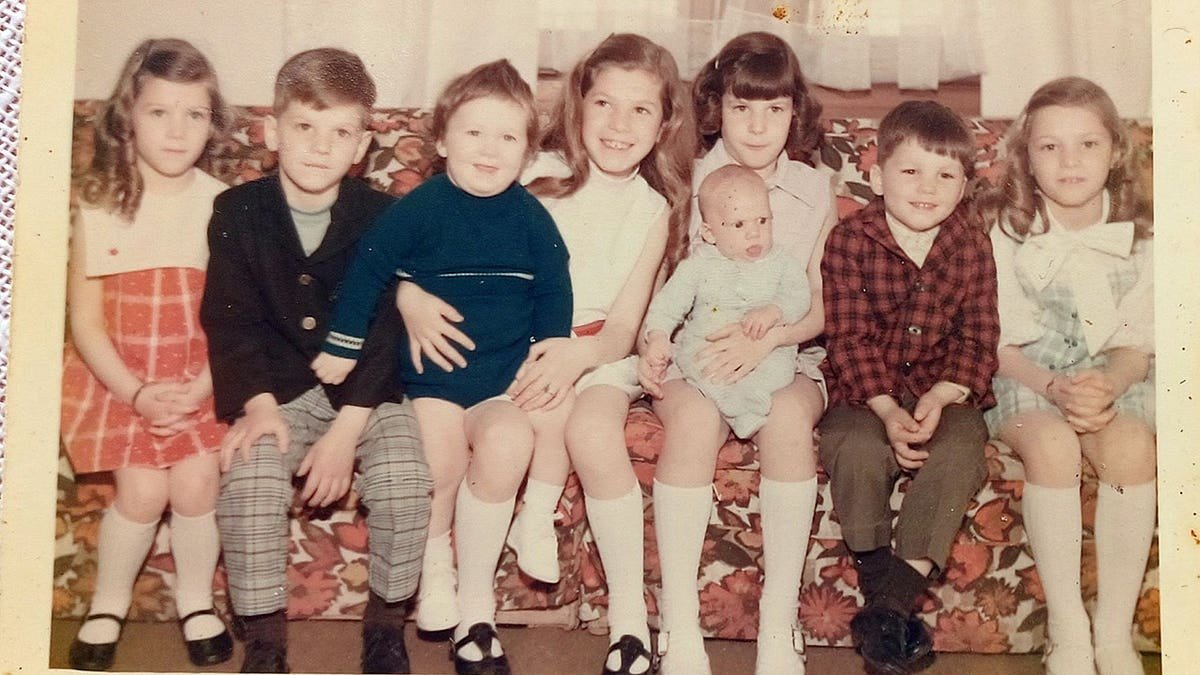 Robert Curatolo with seven siblings as children