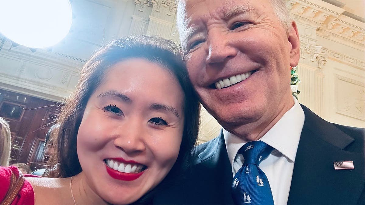 Lindy Li, left, pictured alongside former President Joe Biden, right.