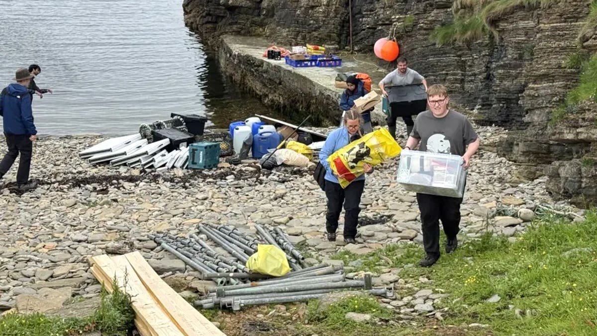 Gordonstoun School students carrying supplies