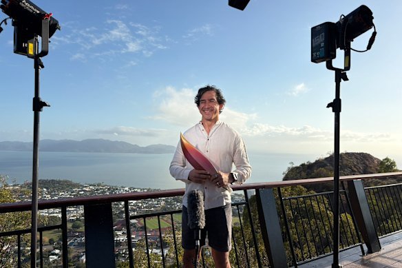 Johnathan Thurston holds the second piece of the mystery Brisbane 2032 emblems.