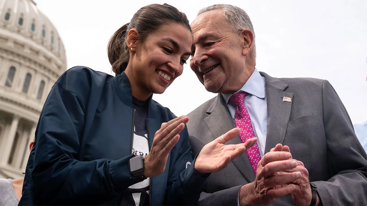 Rep. Alexandria Ocasio-Cortez and Sen. Chuck Schumer chatting together