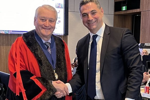 Deputy mayor Peter Harle (in robes) celebrates his appointment with mayor Ned Mannoun in October 2025.