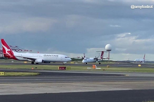 The Boeing 737 (left) and the Bombardier DCH-8 involved in a breakdown of co-ordination at Sydney Airport in July.