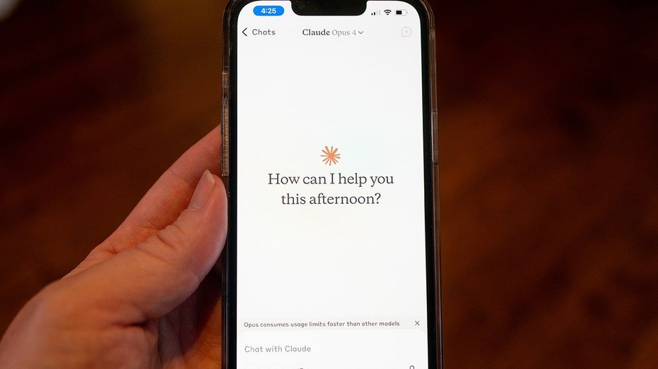 Close-up of a person's hand holding a smartphone and using the Opus 4 model within the Claude app