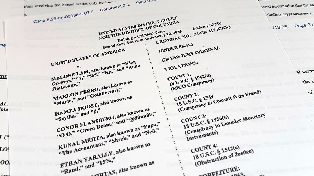 A Justice Department indictment document against Malone Lam is photographed.