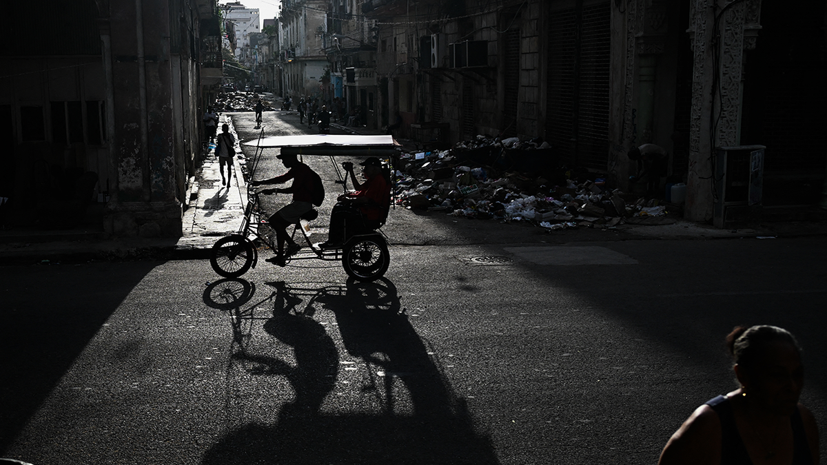 A bicycle taxi travels down a street in Havana during a widespread power outage on September 18, 2026.