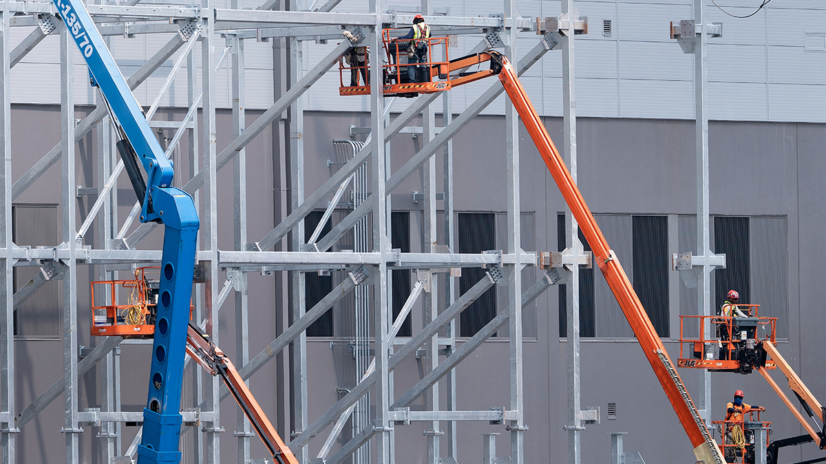 Construction workers building a data center